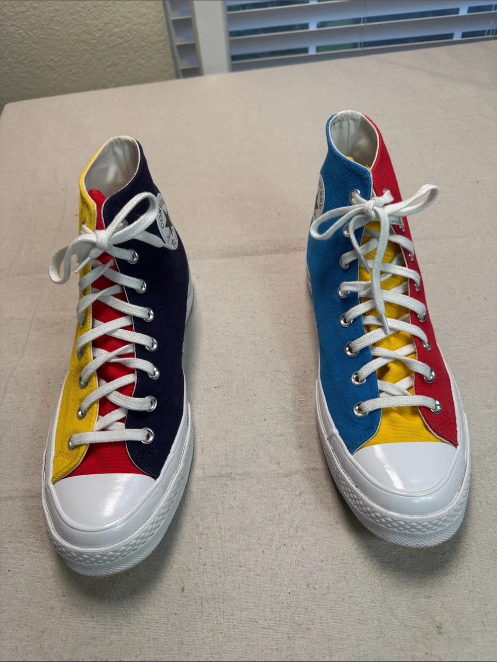 Converse All Star Chuck Golf Wang High Top Sneakers in Yellow, Blue, and Red.